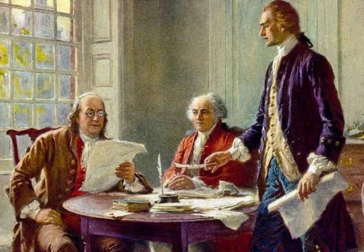 Three men in 18th-century attire engaged in discussion around a cluttered table in a room with a large window, one man standing and two seated, with papers and documents on the table.