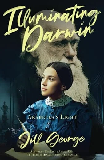 Book cover titled 'Illuminating Darwin' by Jul George, featuring a young woman in a blue Victorian dress with dark hair, and an older man with a long white beard and light hair in the background.