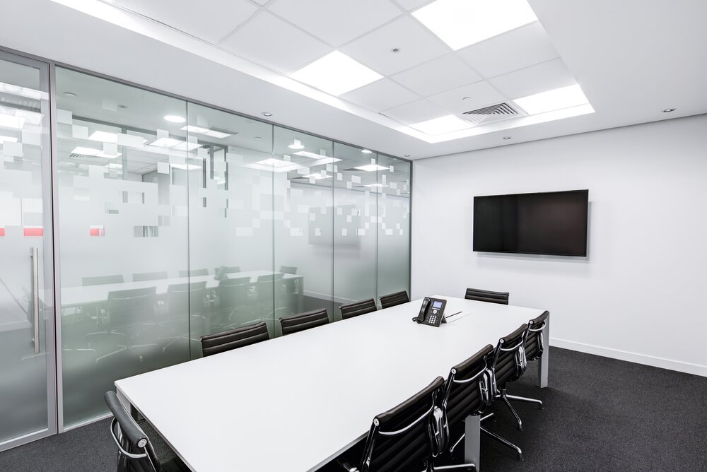 Conference rooms like the one depicted here can be challenging due to lights reflecting in the glass.