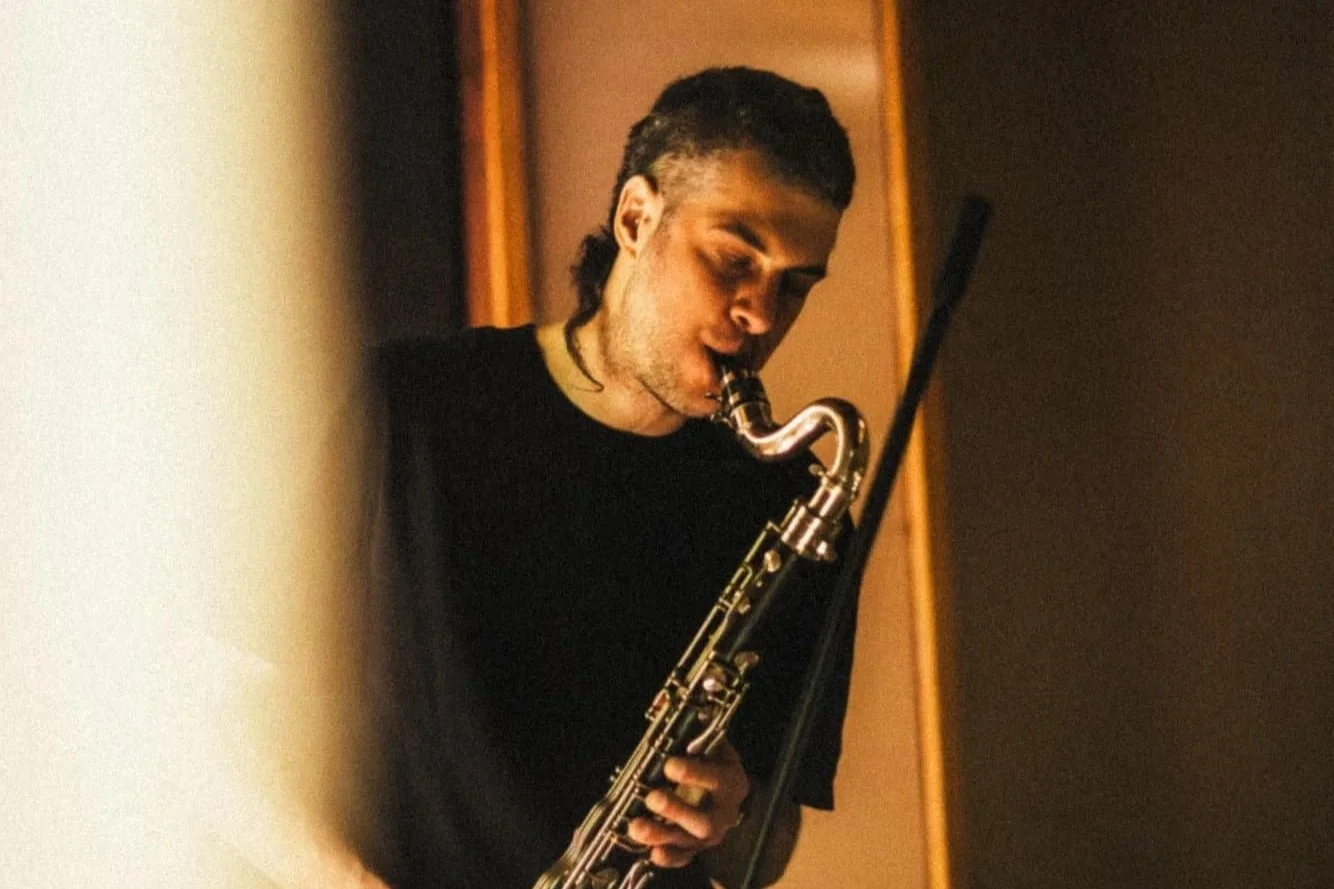 Tarquin playing a saxophone.