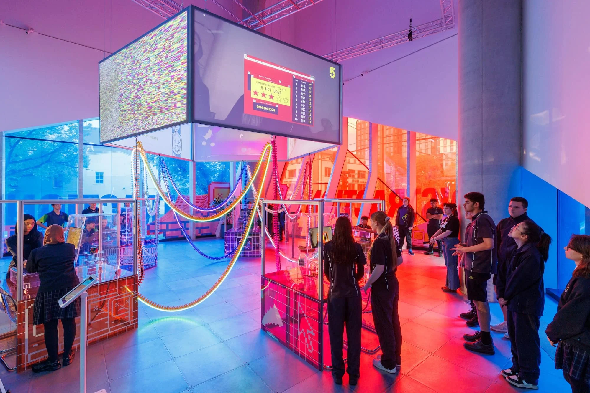 Students interacting with digital exhibition display