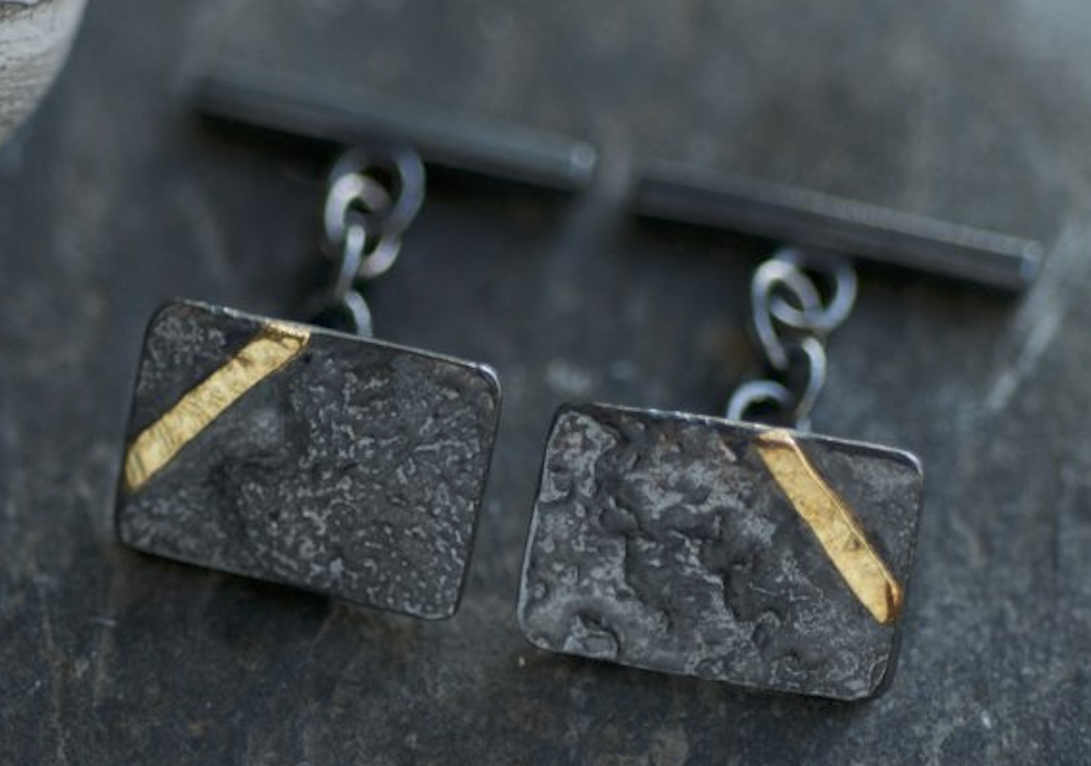 textured black and gold cufflinks