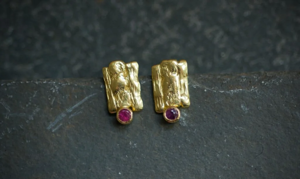 textured gold stud earrings with stones