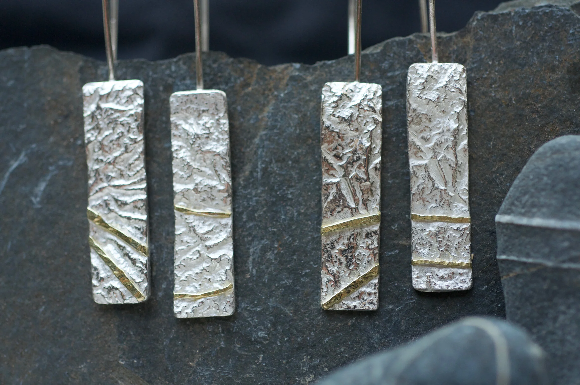 TEXTURED SILVER EARRINGS WITH GOLD SEAMS