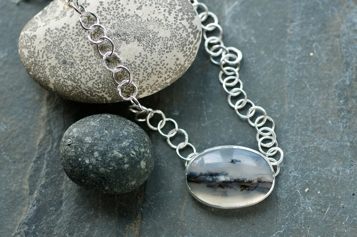 Oval dendritic quartz on silver chain.jpg