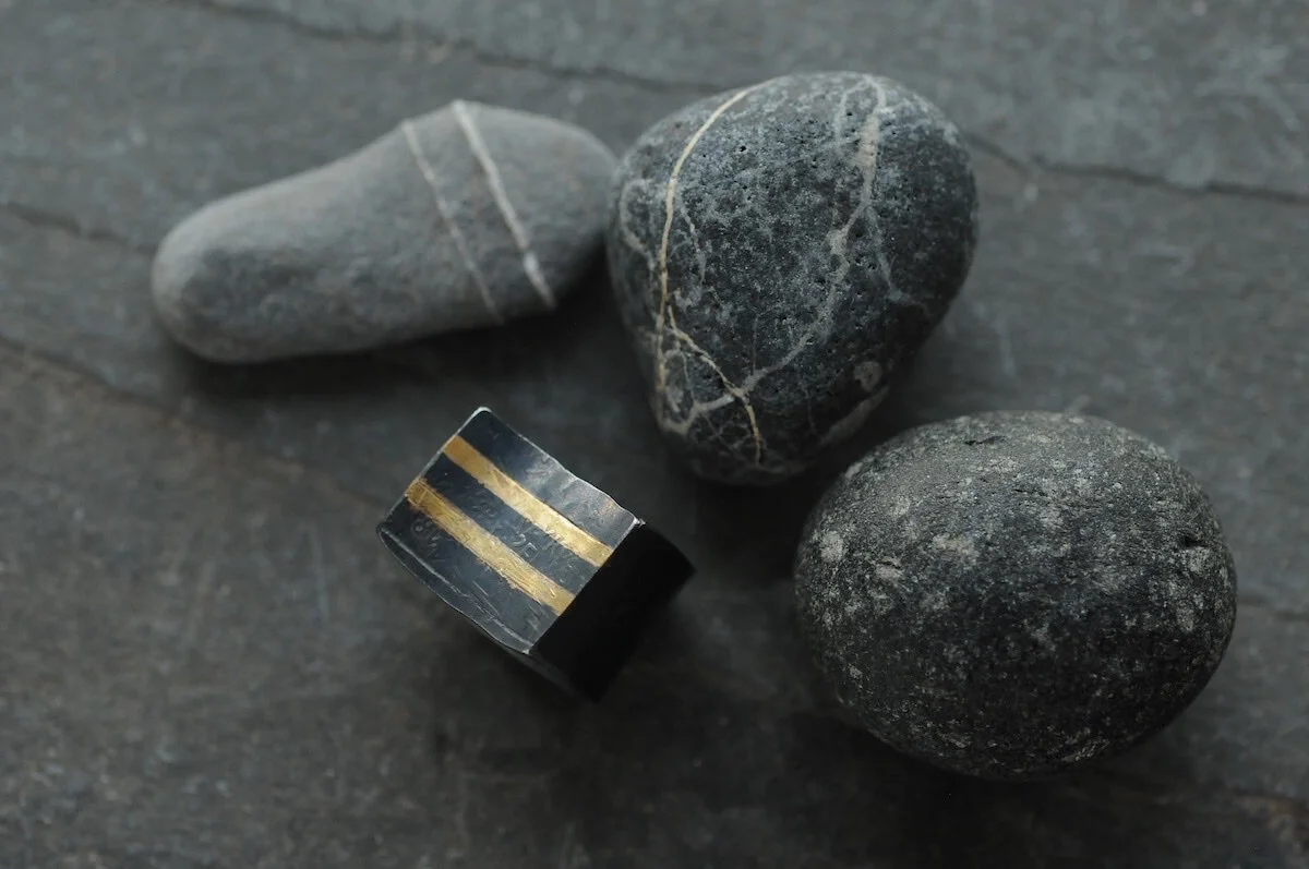 Gold and silver striped ring with curved top 2.jpg