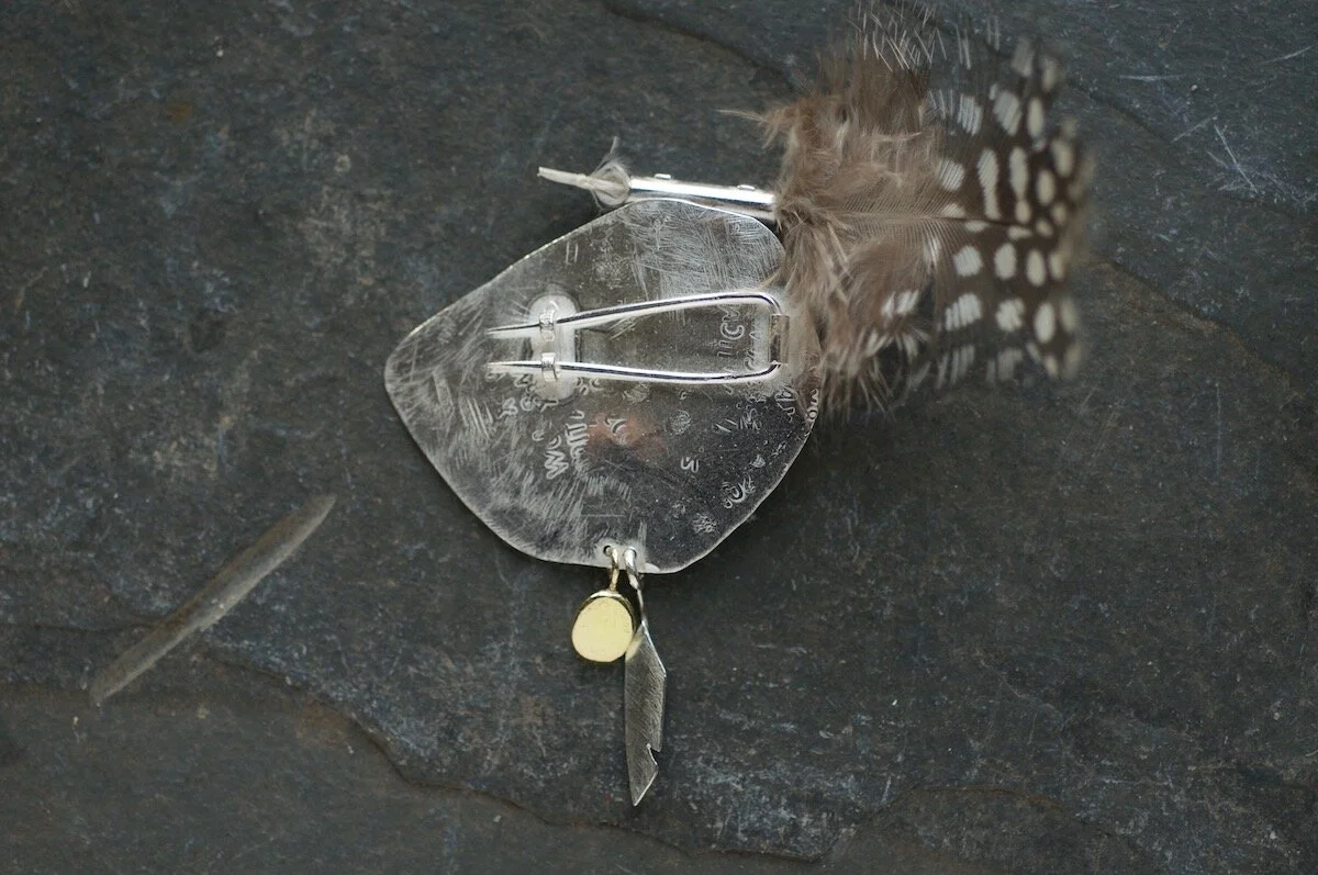 Talisman endangered bird brooch back