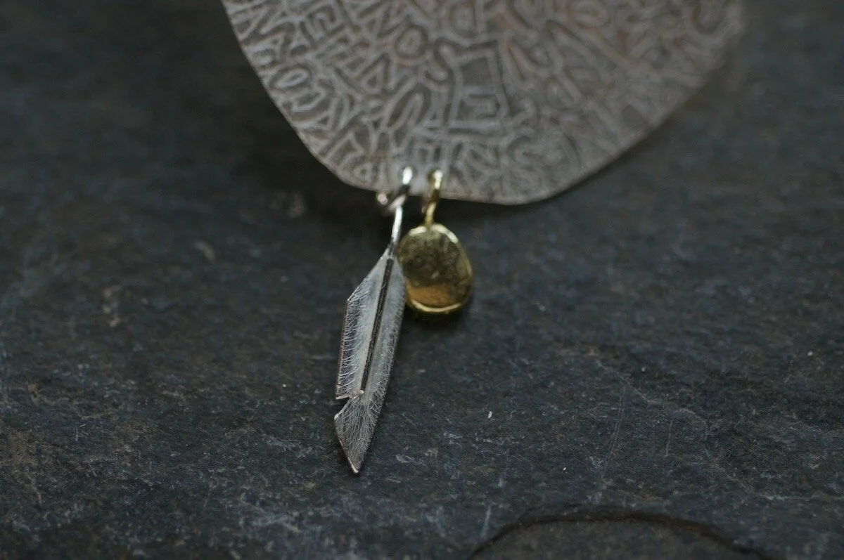 feather and gold egg