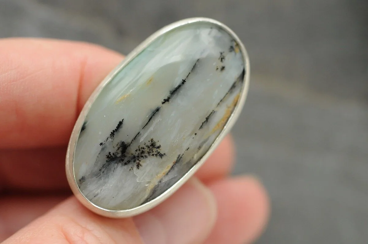 Dendritic opal in simple contemporary ring setting