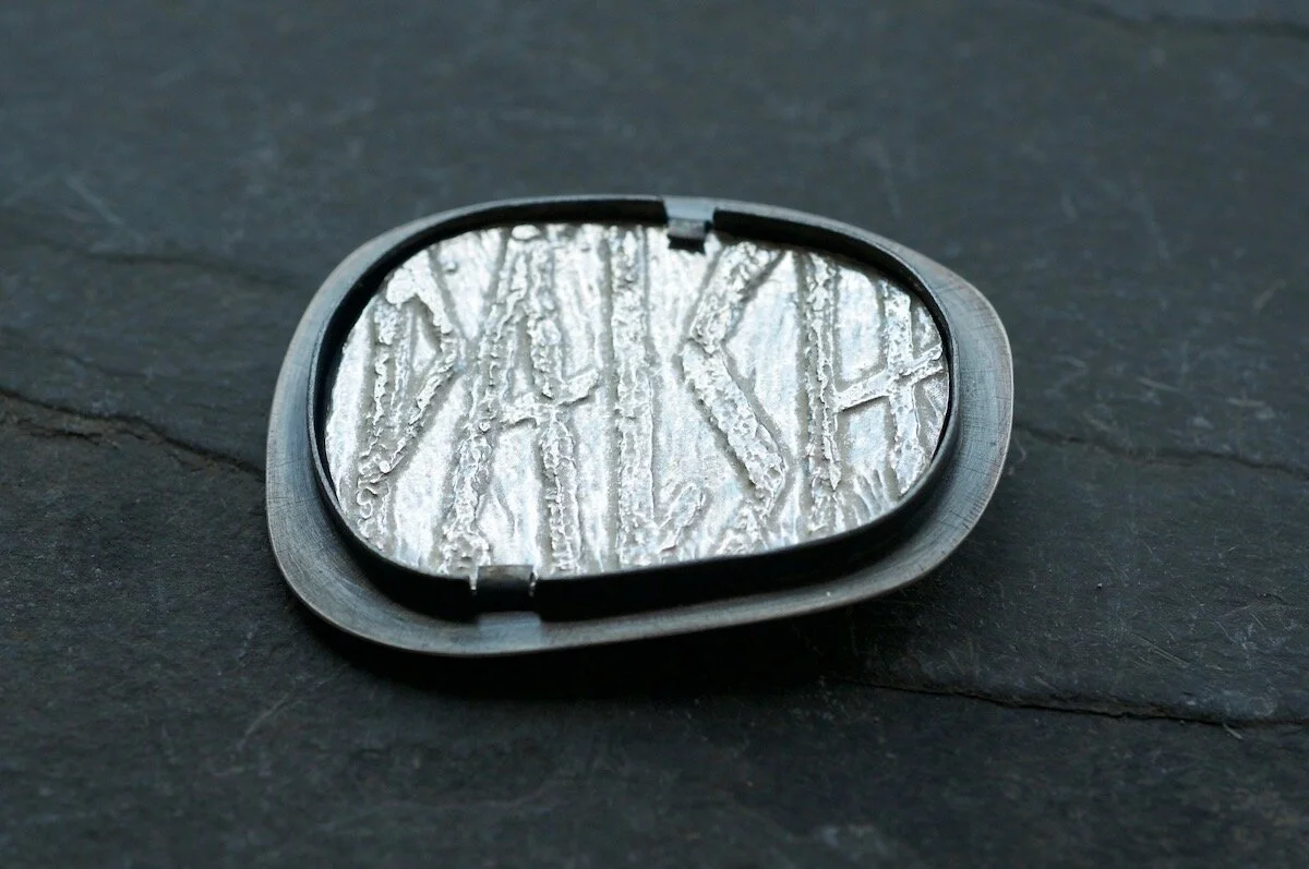 Word hord brooches palsh on slate.jpg