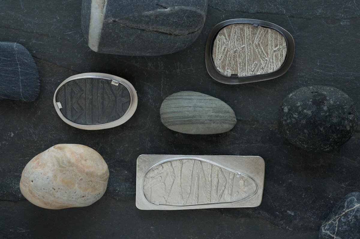 Word hord brooches with pebbles.jpg