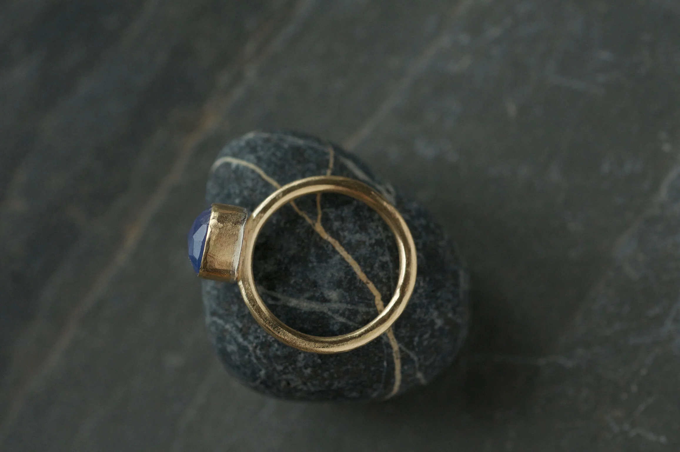 Side view and gold and tanzanite ring