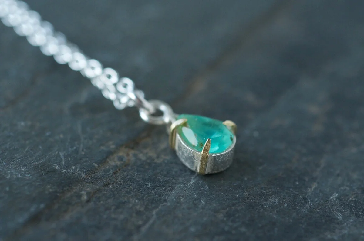 Peruvian blue opal pendant with gold claws
