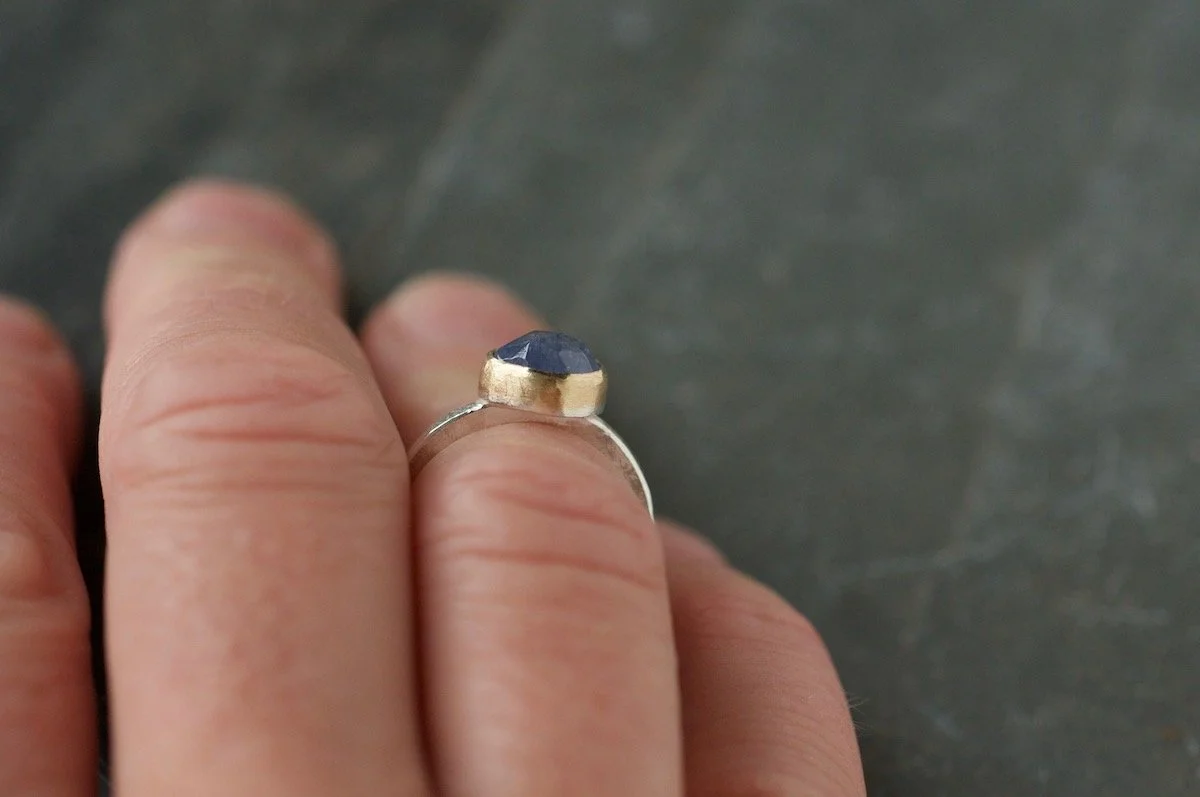 9ct gold and silver tanzanite ring on finger.jpg