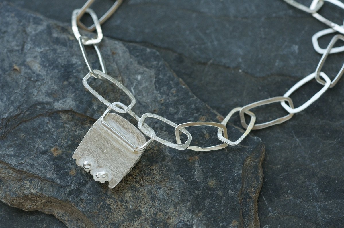 back detail os ocean jasper cabochon setting