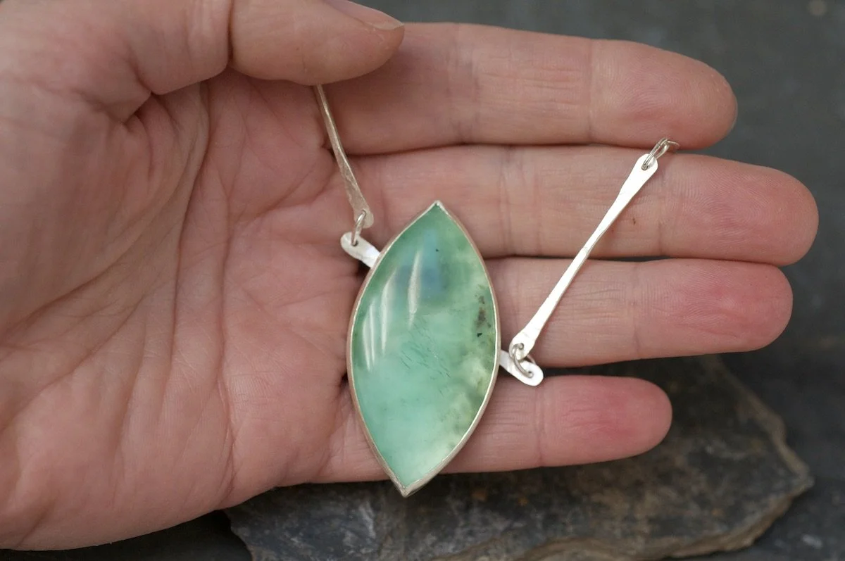 Peruvian blue opal marquise cabochon necklace in hand.jpeg