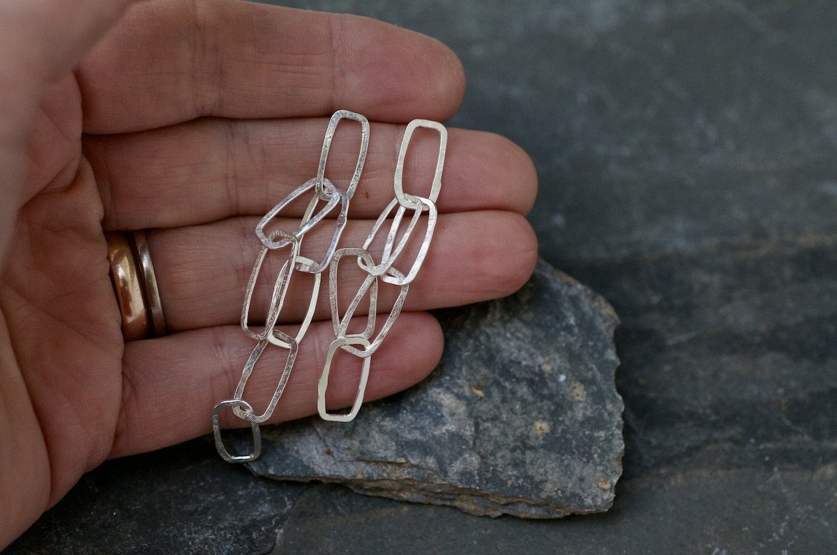 Mini monolith chain earrings in hand.jpeg