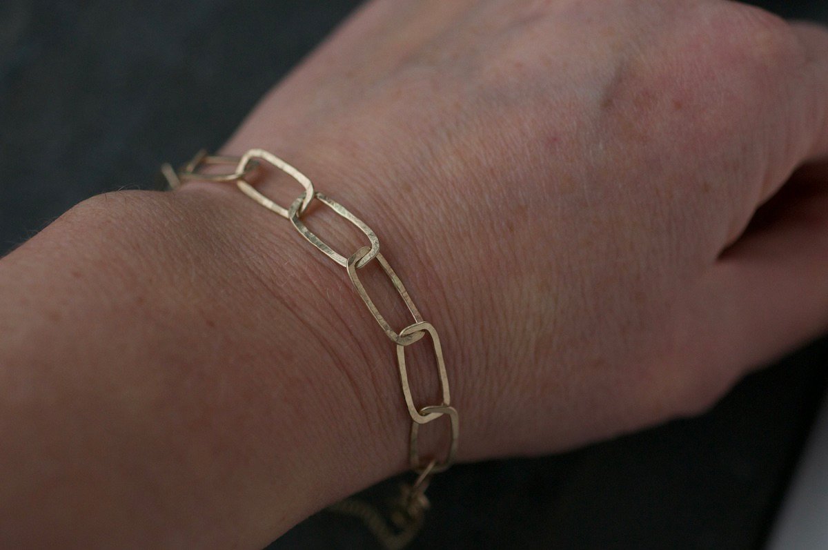 9ct-gold-rectangular-hammered-link-bracelet-on-a-wrist-light.jpg