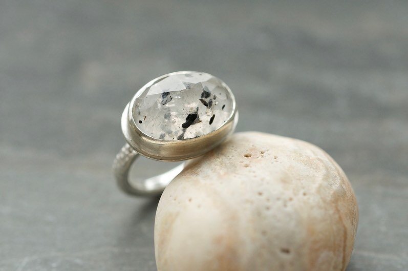 I&rsquo;ve a new favourite stone! This is mica quartz, little speckles held in clear quartz like a story frozen in time. The ring shank is etched with the names of endangered moths, their stories and their futures are fragile little treasures held in