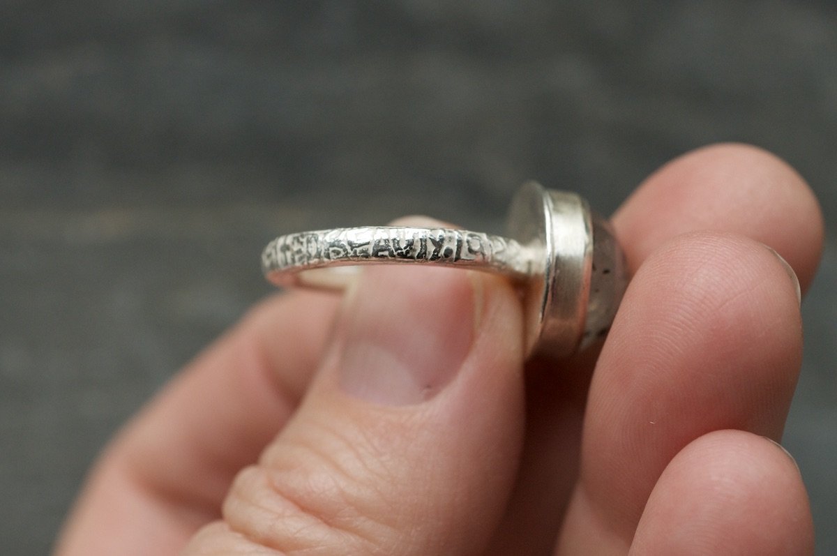 ring etched with endangered moth species