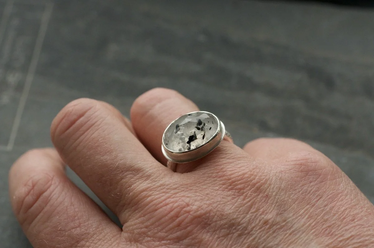 black mica quartz ring on a model