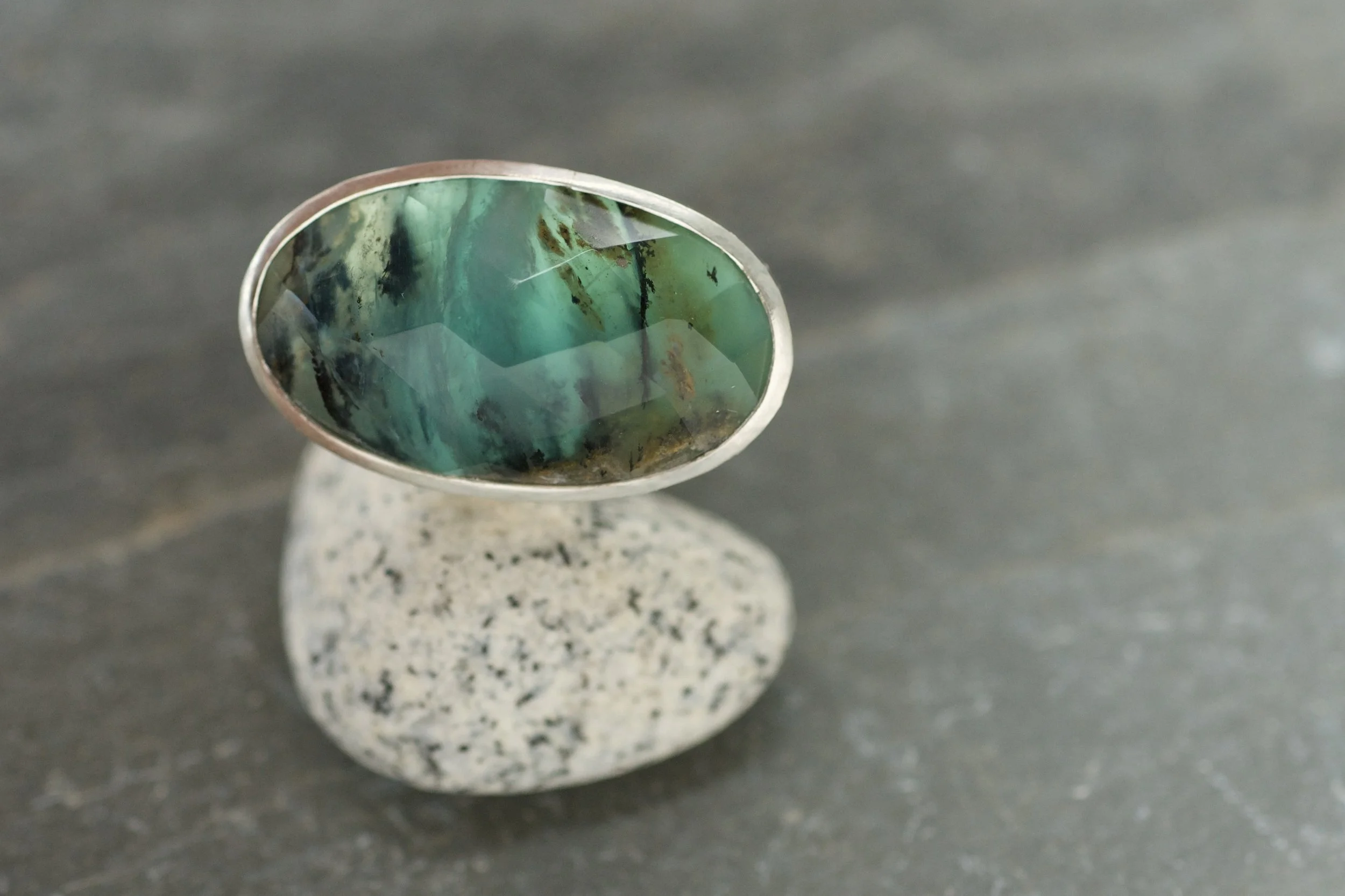 Peruvian blue opal rock pool ring on pebble.jpeg