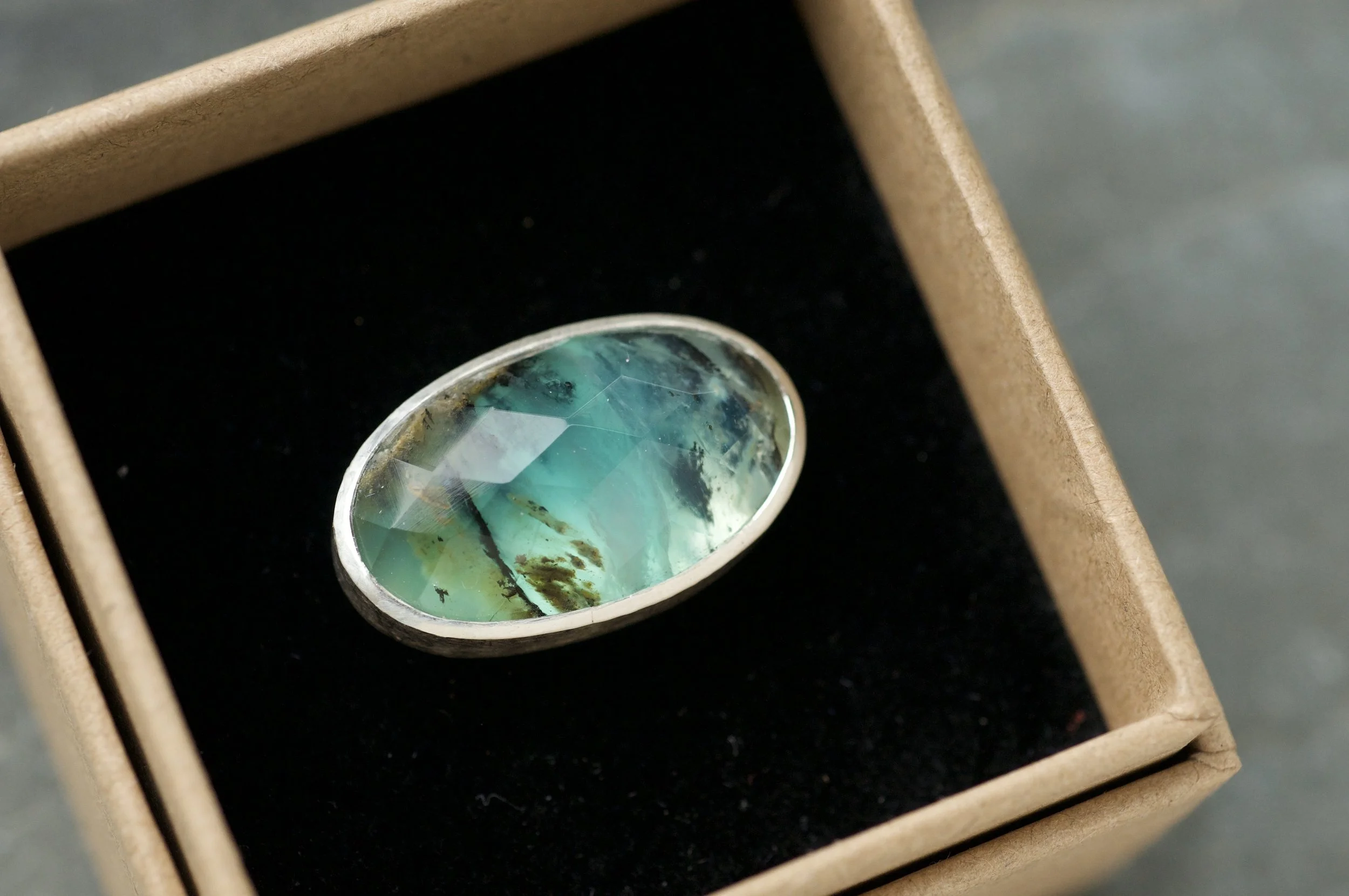 Peruvian blue opal rock pool ring in jewellery box.jpeg