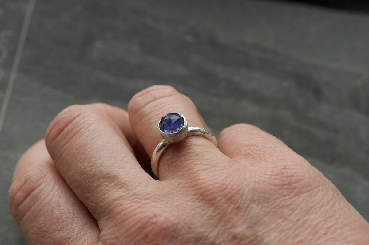 Iolite and silver ring on hand.jpeg