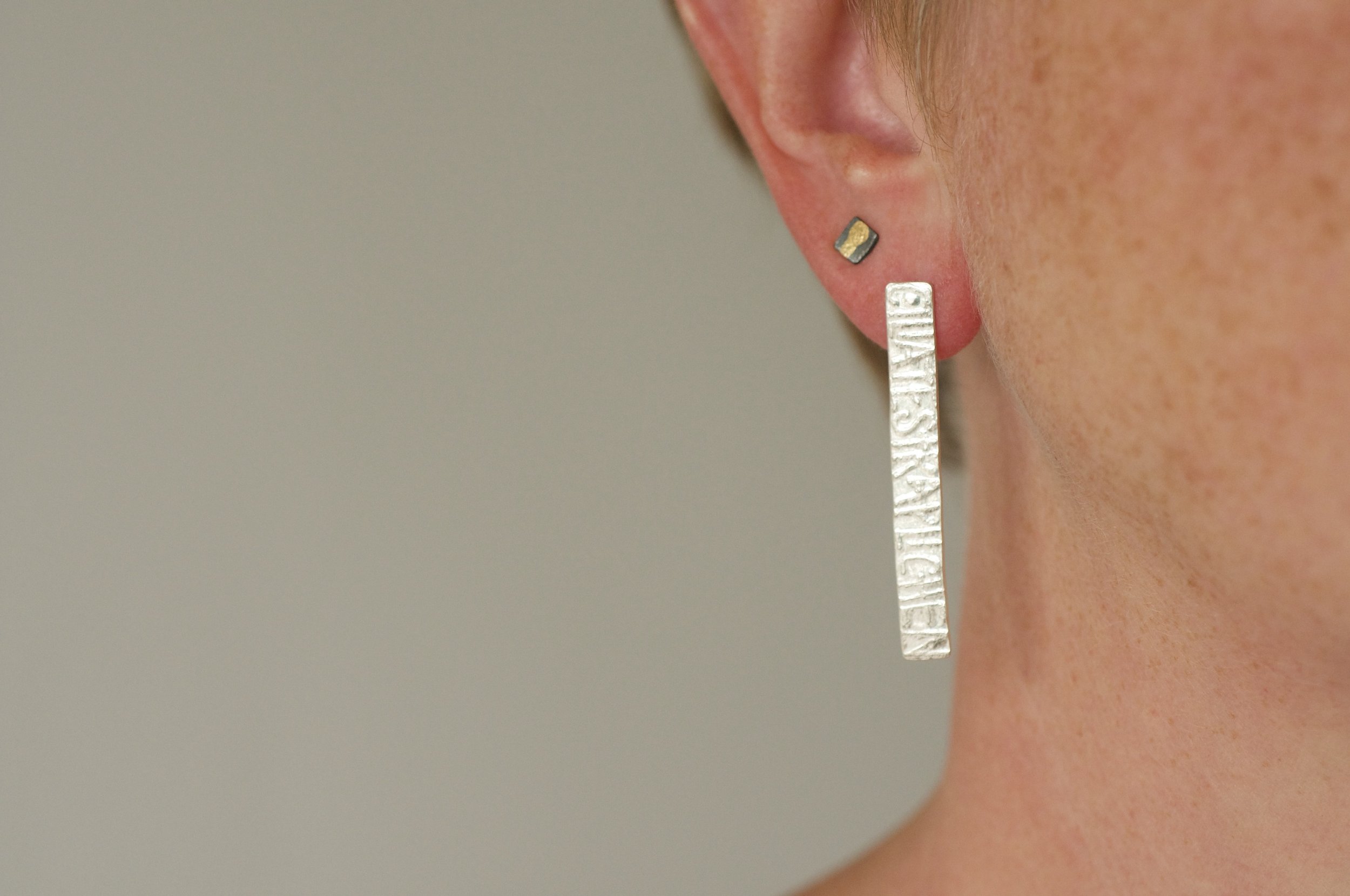 Lucy wearing talisman bar earrings 2.jpeg