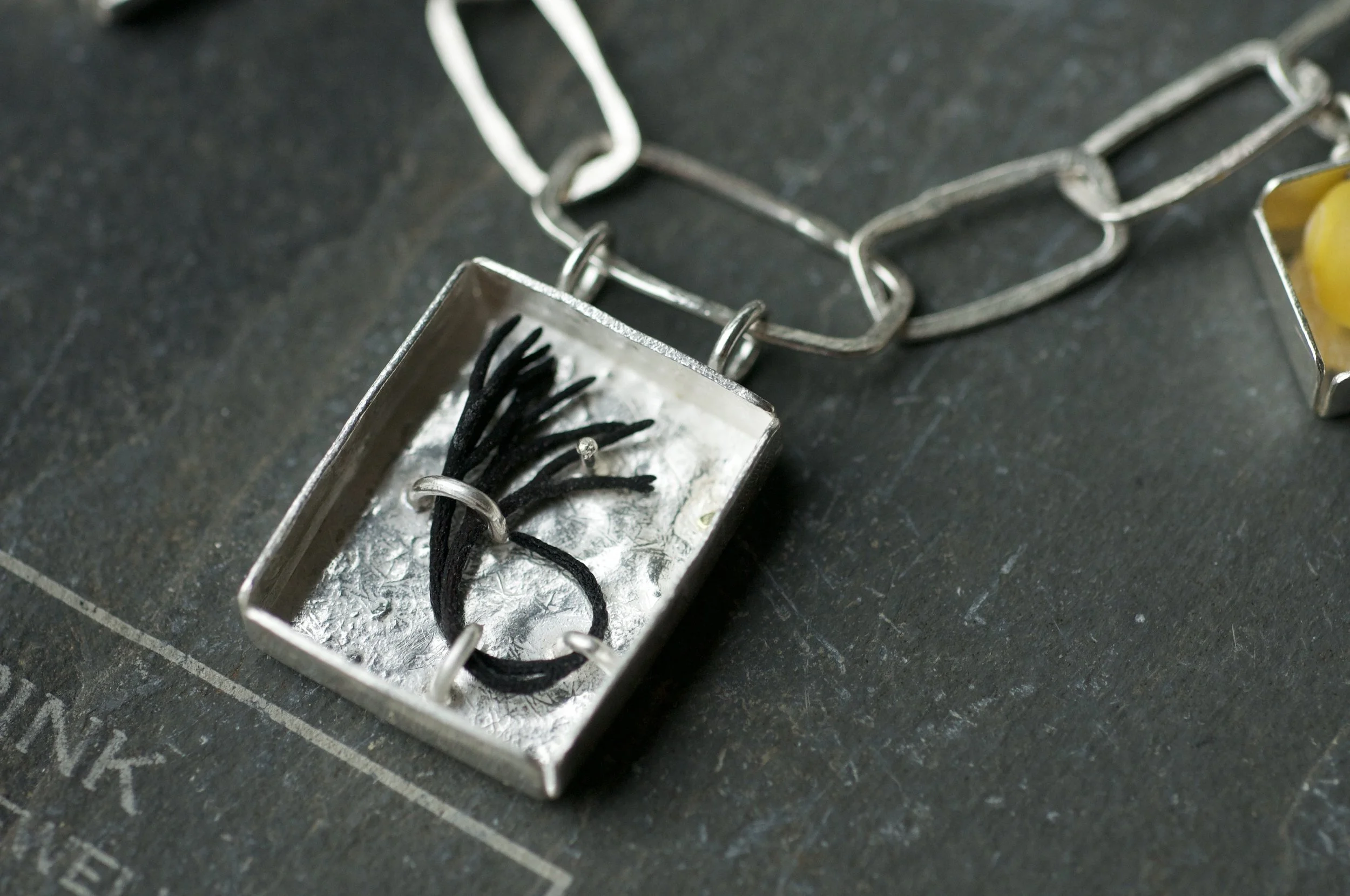 Collectors necklace with box charms seaweed.jpeg