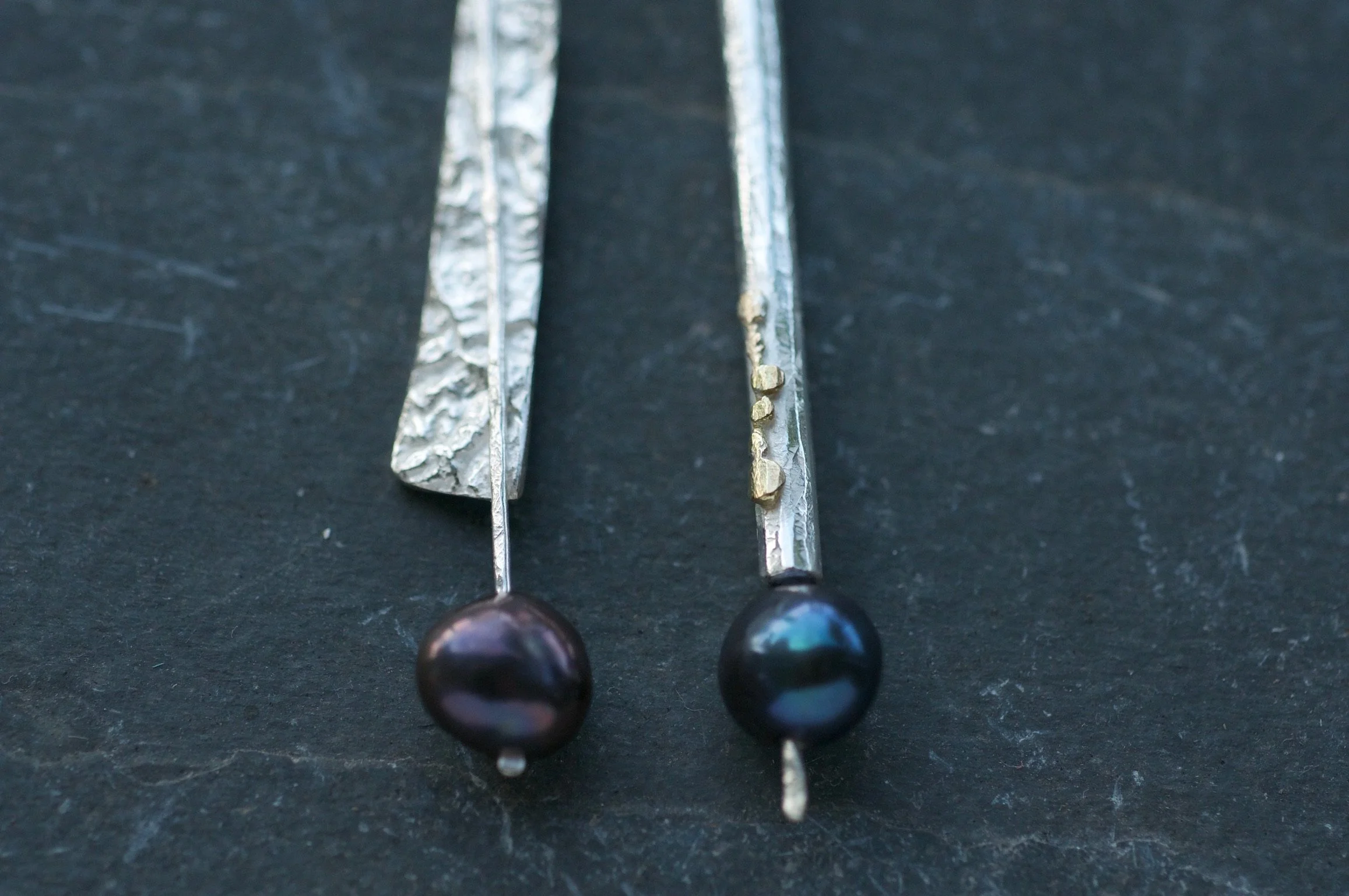 Mismatched Tahitian pearl earrings with gold details