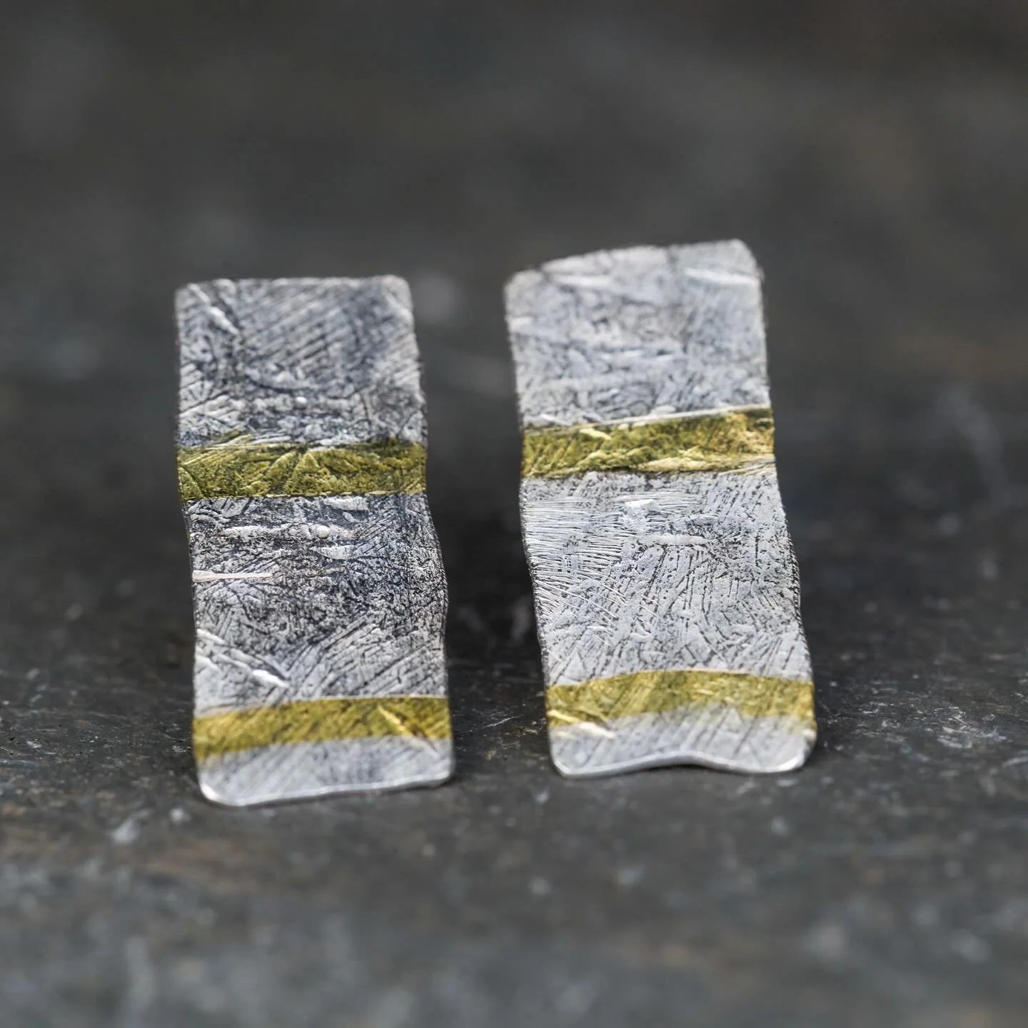 Gold embedded into the surface of silver then hammered out into rough rectangles that catch the light. 

Not everyone&rsquo;s cup of tea but I am a huge fan of texture and use it in all of my work. I think it comes from my days in photography which i