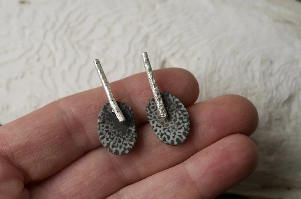 Statement earrings with fossilised coral