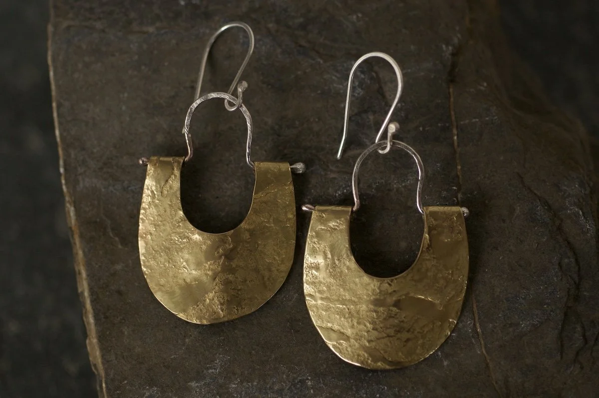 Brass lunula earrings hammered on granite