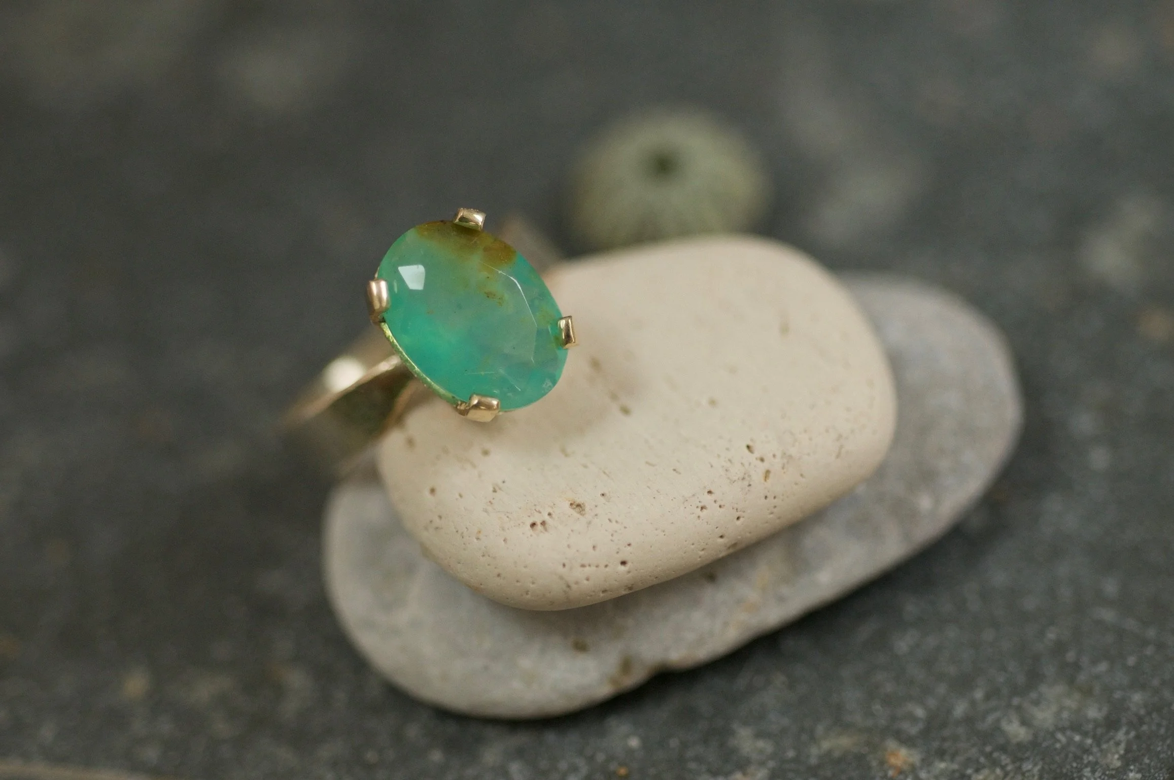 Elegant blue opal ring set in gold claws.jpeg