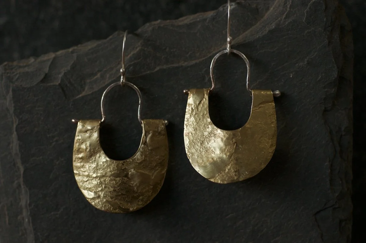 Brass lunula earrings hammered on granite