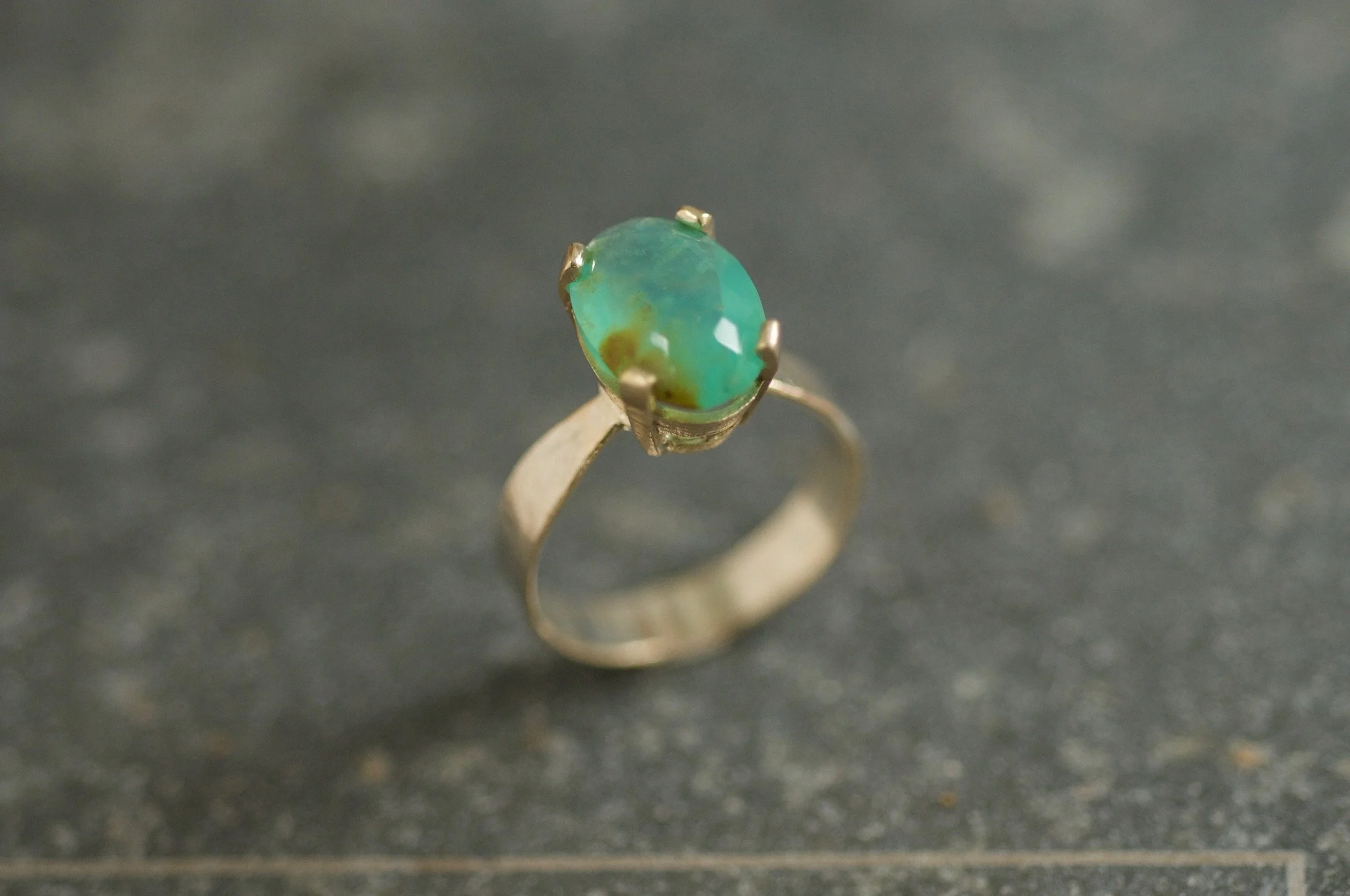 Elegant blue opal ring in gold setting