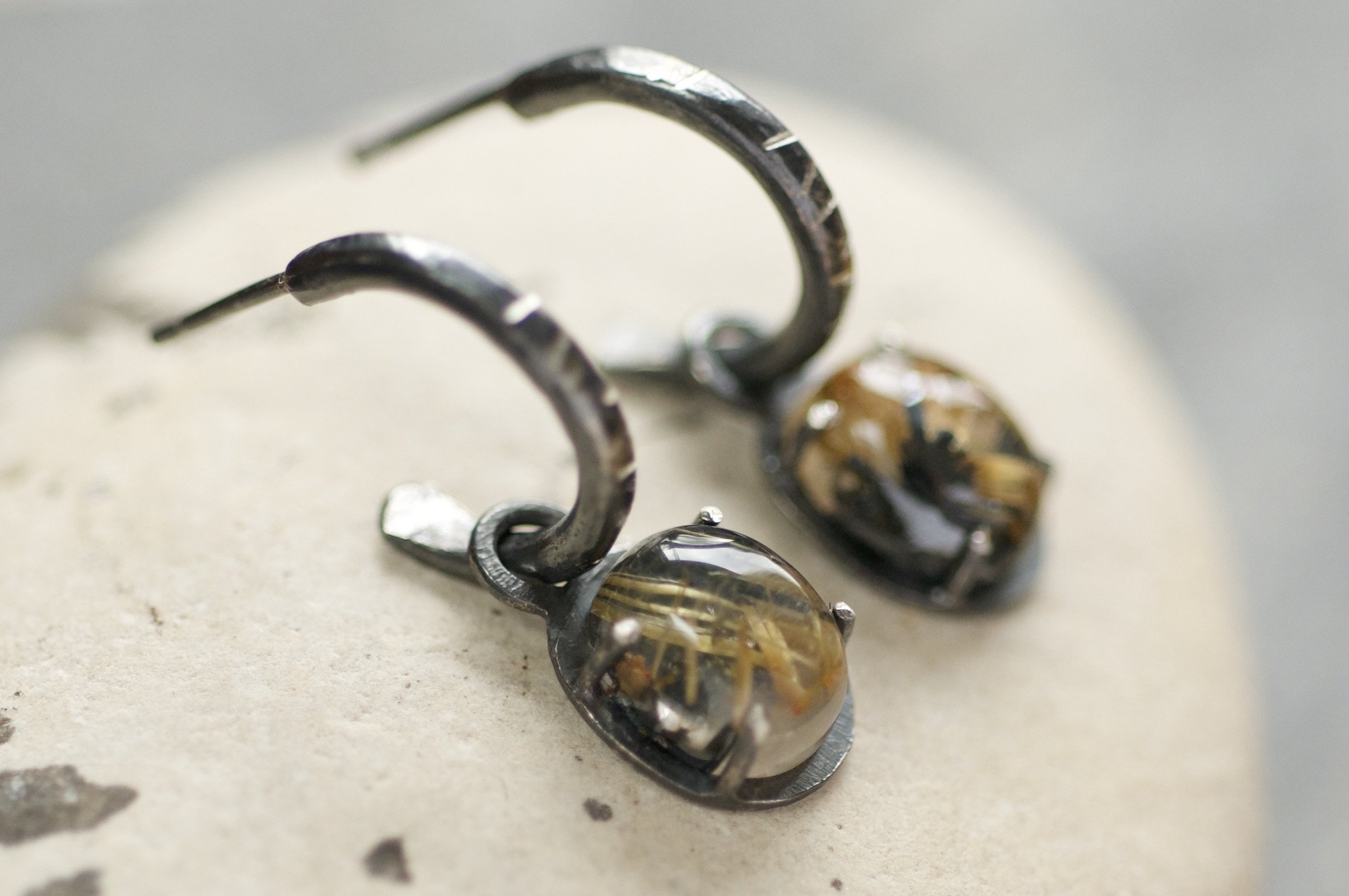 Small silver hoops with golden drops