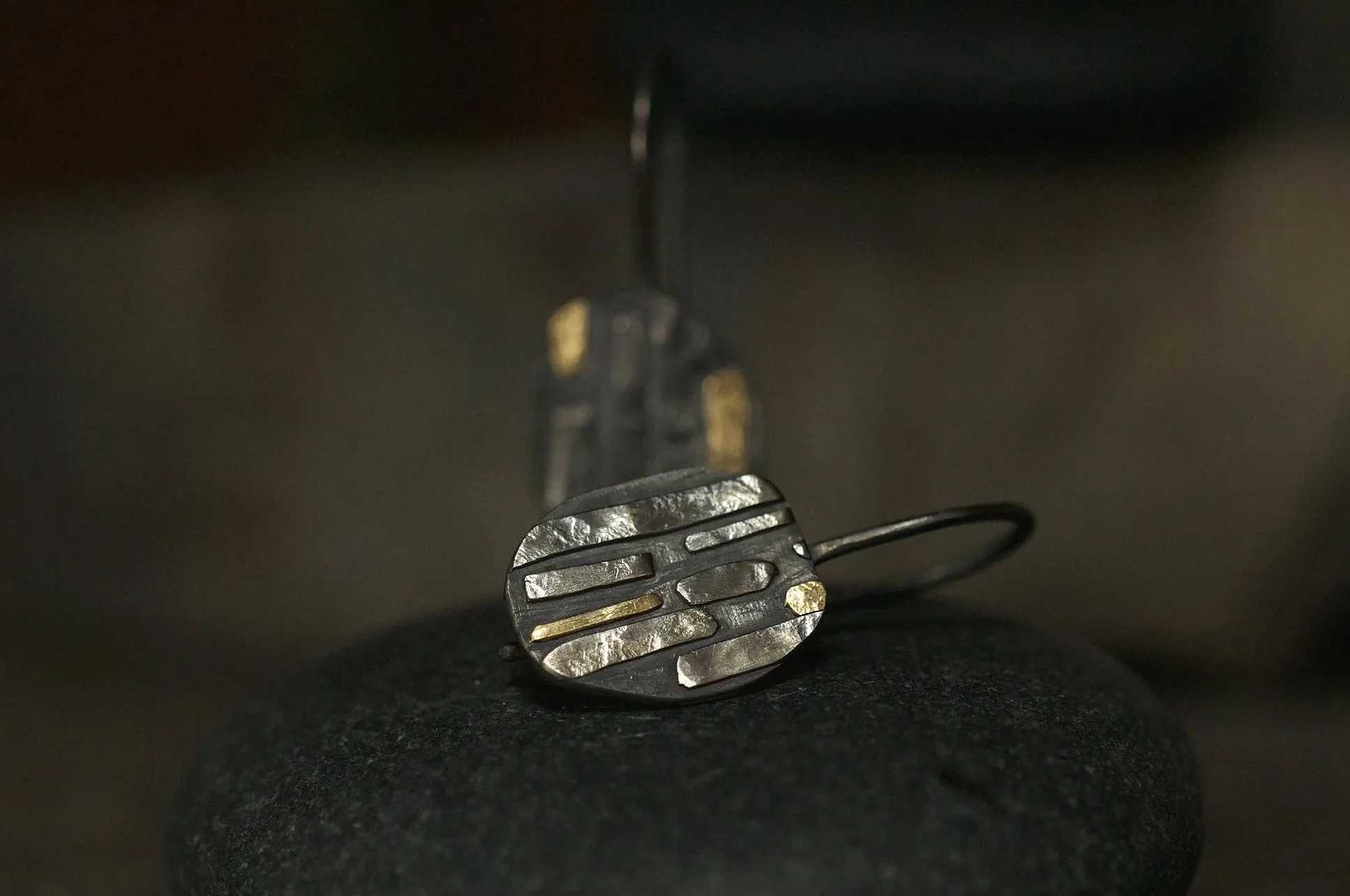 black and gold pebble earrings