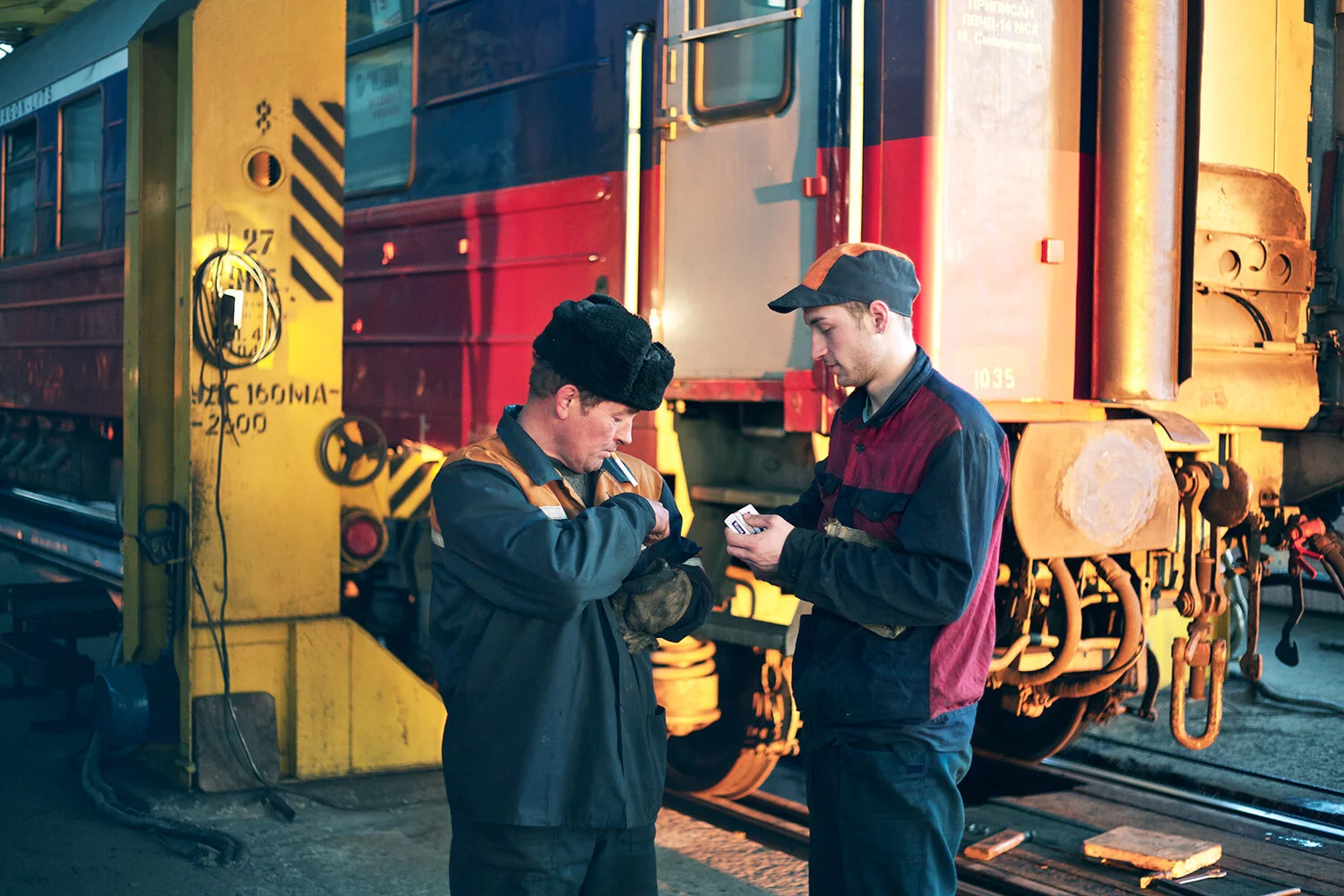 Two workers at a station in Russia.jpg