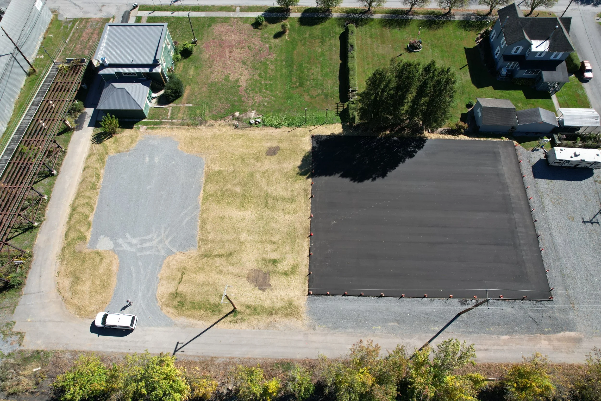  Site after construction of parking lot and paved future pickleball court area 