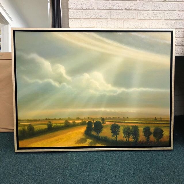 We love the floating frame chosen for this @matthewhasty painting. The champagne gold finish really draws out the light in the sky. Today&rsquo;s the perfect day to bring in some artwork to be framed, swing by!! 💗💗💗❤️⚡️