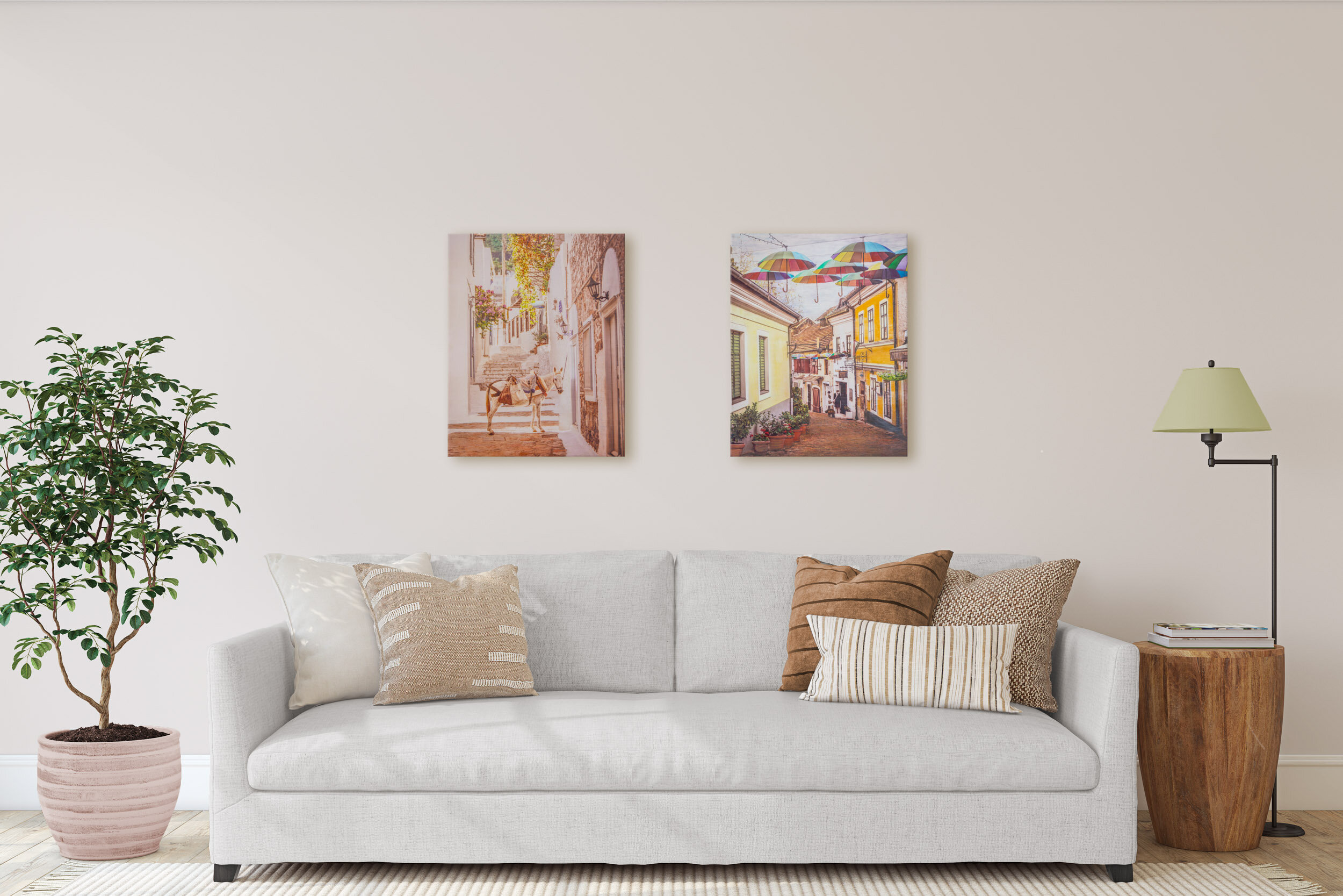Two encaustics displayed over couch