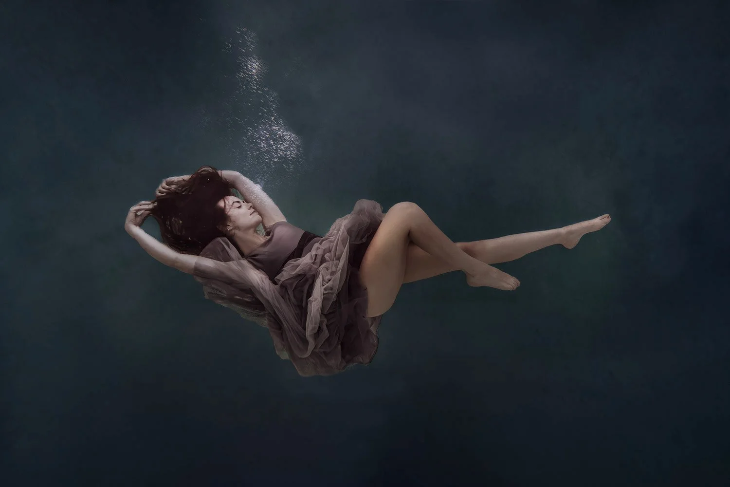 woman-floating-underwater-elegant-dress.jpg