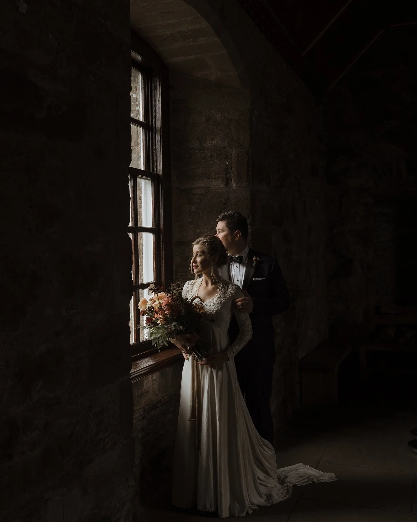 On the edge of the North East coast, where the land meets the sea, Alex and Ian chose something quieter.

Sheltered by the stone walls of Dunnottar Castle, their day unfolded slowly. No rush, no noise. Just the two of them, the sound of the waves bel