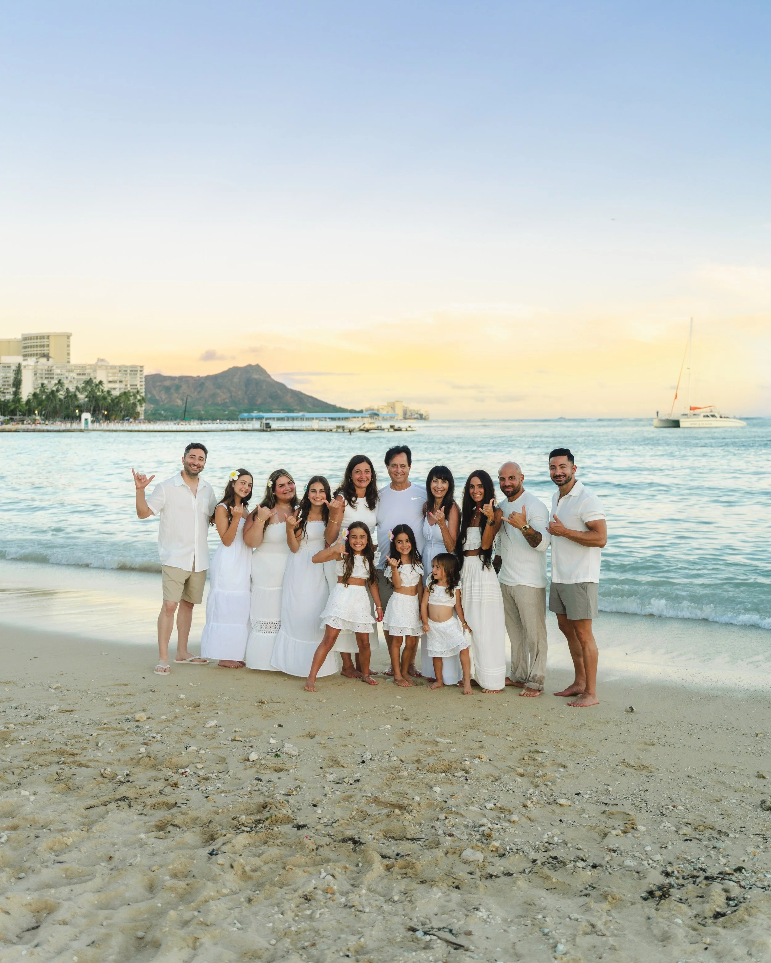 Large family vacation portrait during golden hour in Waikiki, Hawaii
