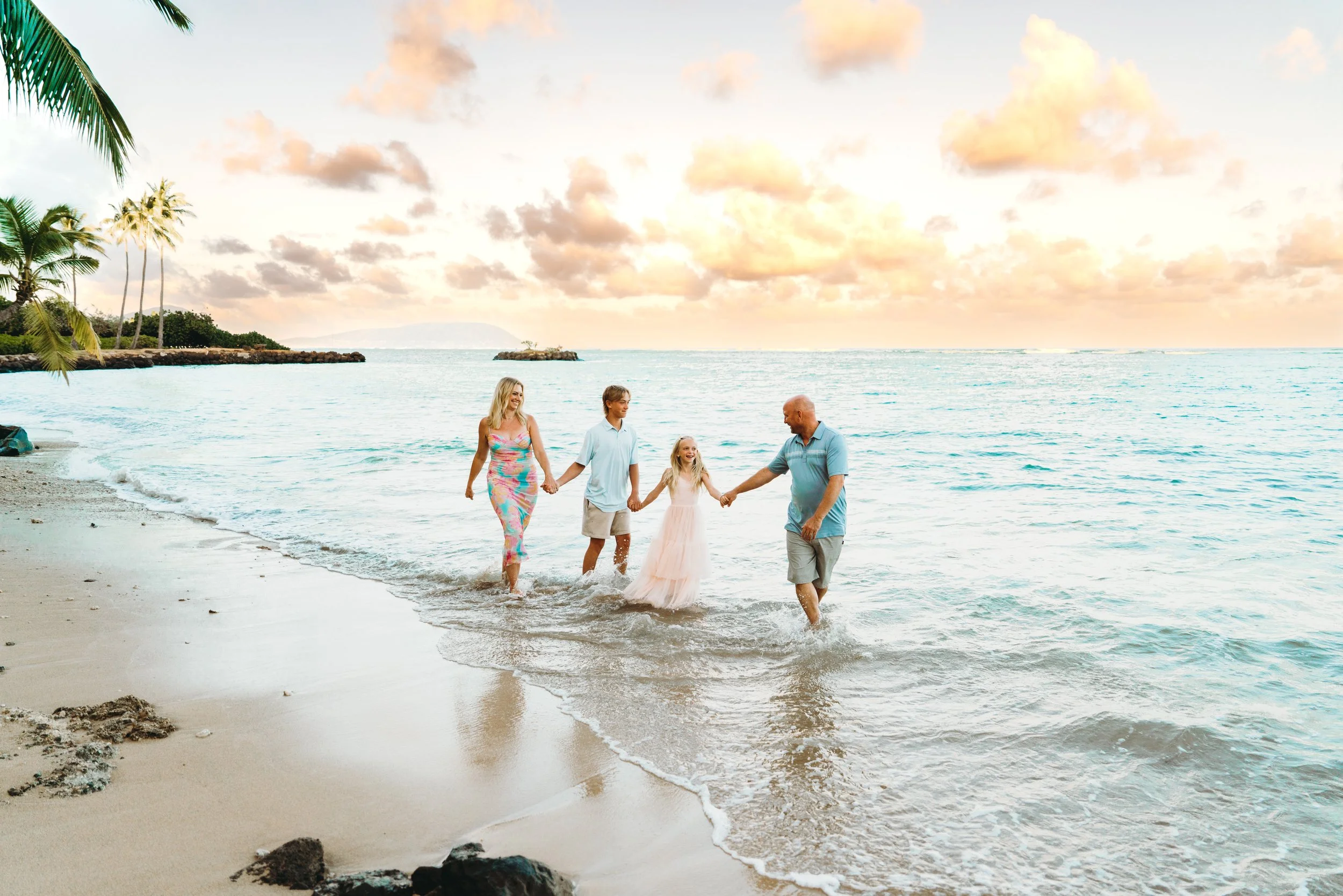 Natural family vacation photos during golden hour at Kahala Beach in Honolulu