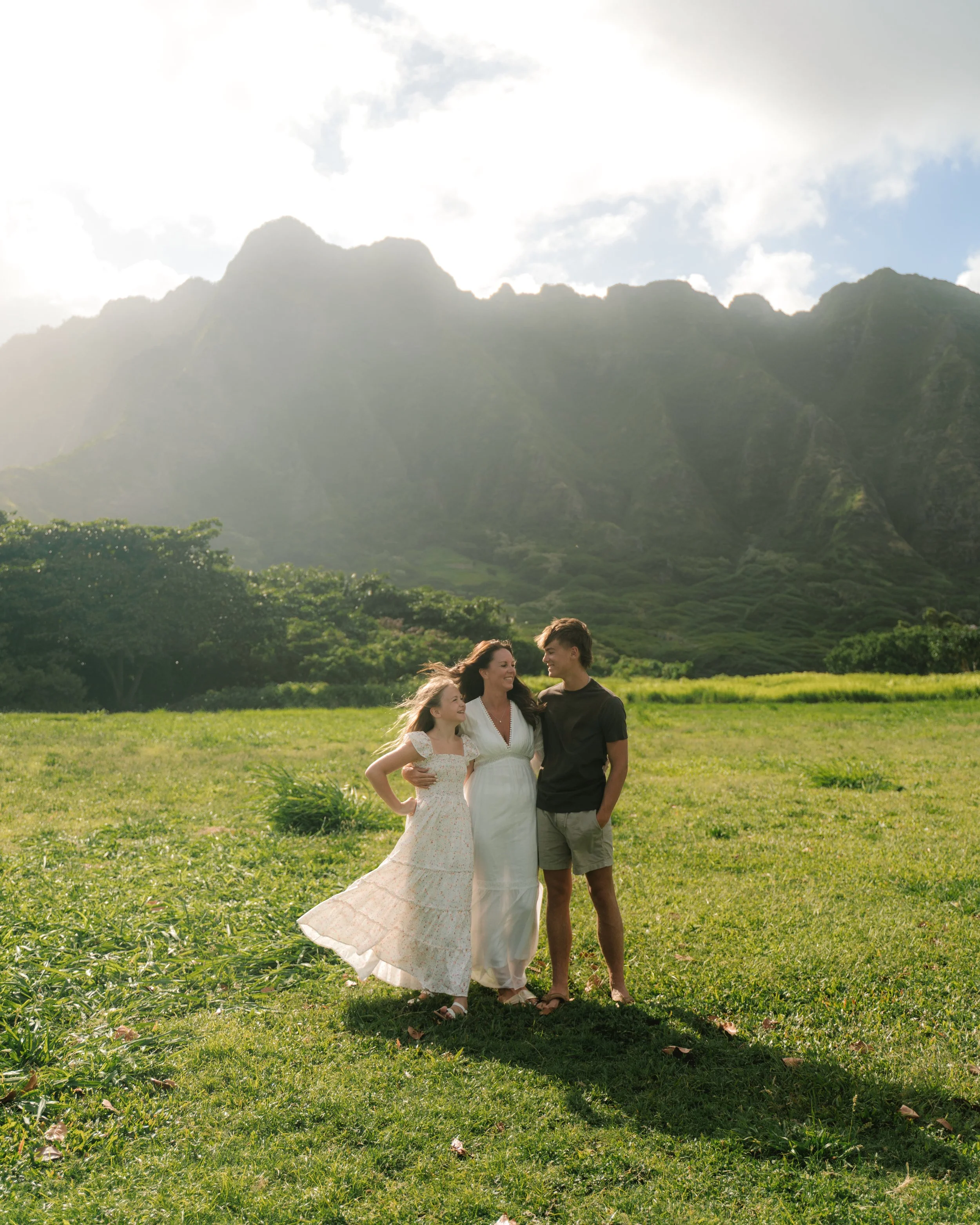 Natural family portrait photographed at Kualoa Regional Park on Oahu Hawaii