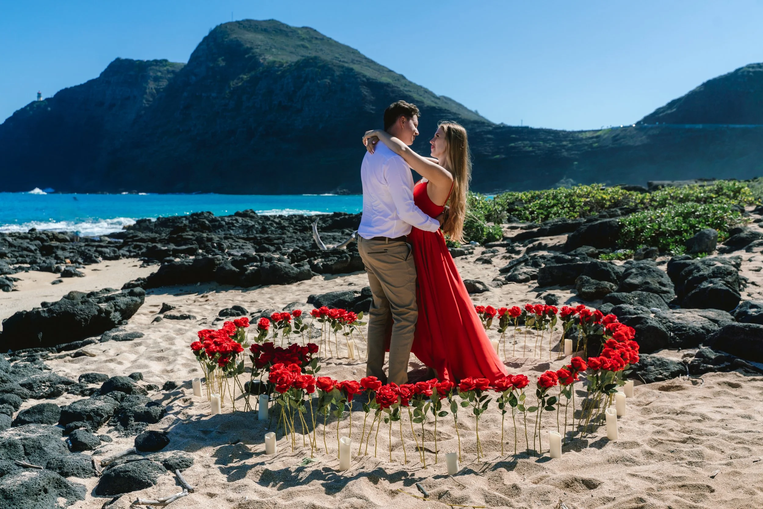 Surprise proposal overlooking the ocean during an Oahu proposal photography session at Makapuu.