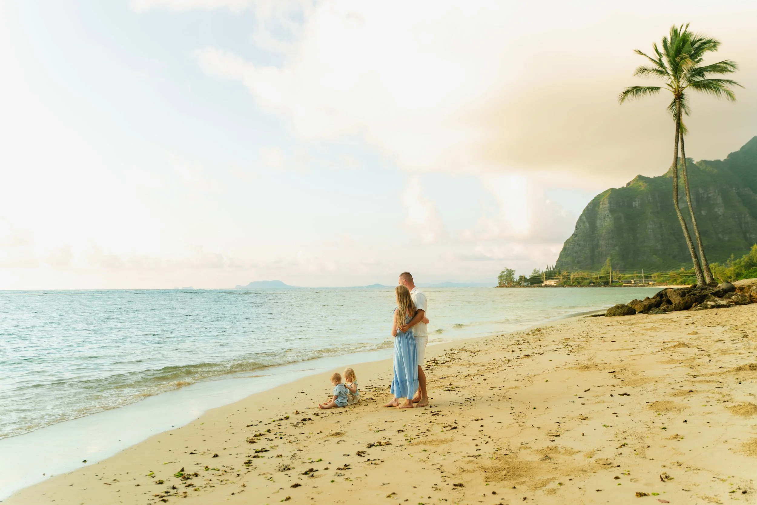 Sunrise family photography session in Kaaawa with lush mountains and tropical scenery on Oahu Hawaii.